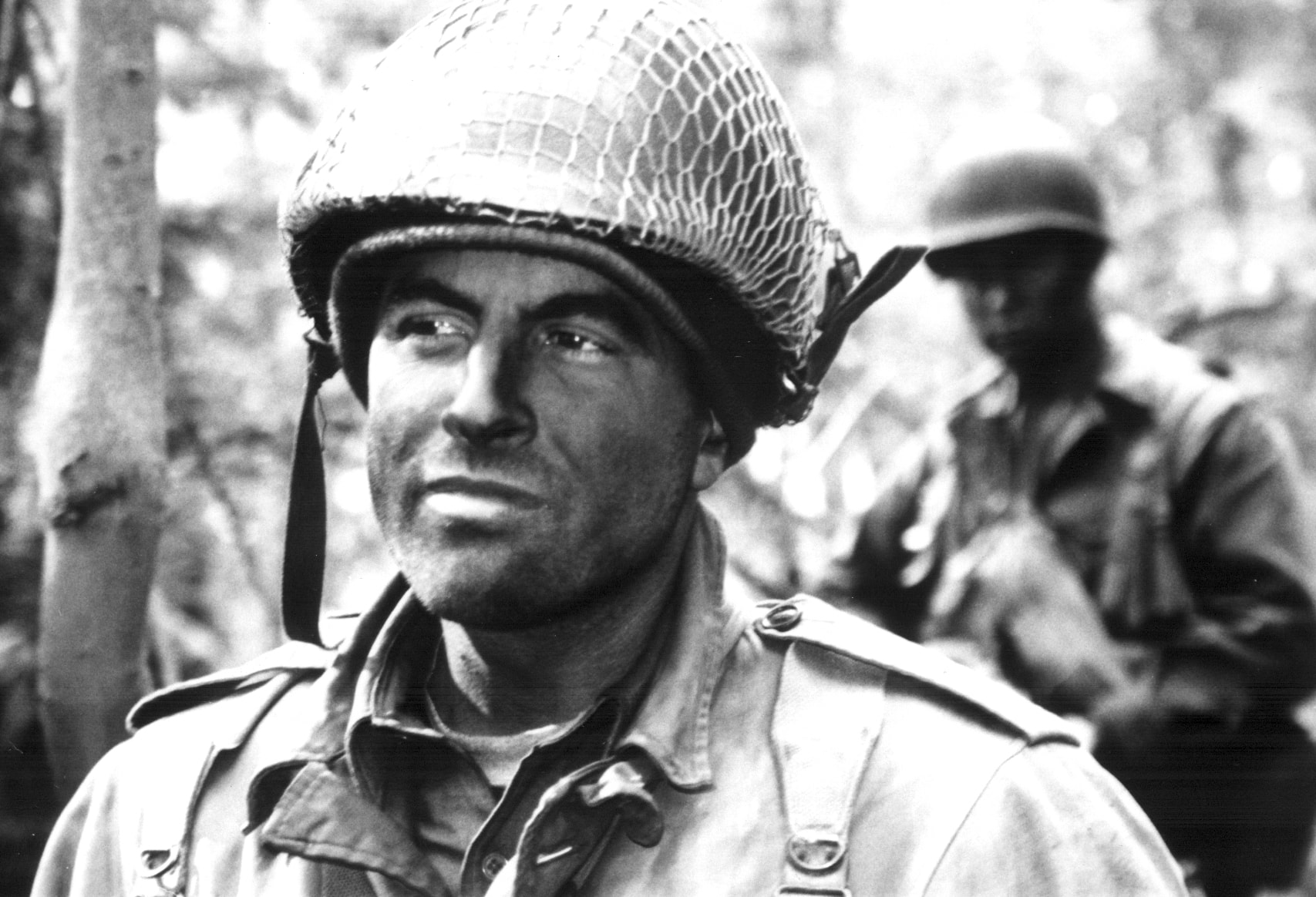 Close portrait of an American soldier in helmet looking off camera